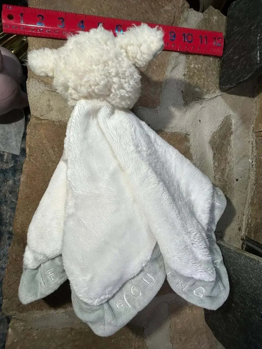 Grasslands Road white lamb sheep lovey with writing on edges
